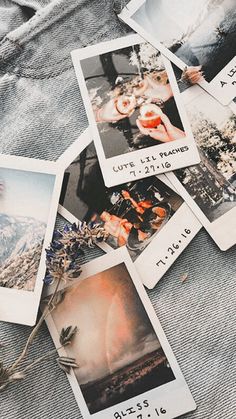 several polaroid pictures are laying on top of a pair of blue jeans and some flowers