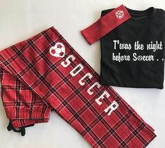 two matching pajamas and one t - shirt with the word soccer printed on it are laying next to each other