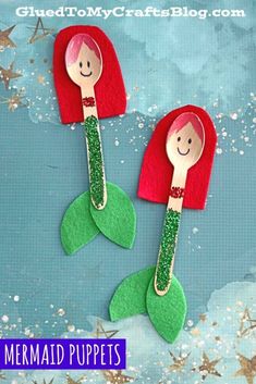 two little mermaids made out of felt and wooden spoons with glitter on them