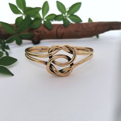 "This simple and stunning Love Knot bracelet was handmade in Mexico. Handcrafted to the highest quality from 3 mm solid brass wire. Declare your eternal love and friendship in style! The love knot symbolises the unbreakable bond and eternal connection between lovers. The bracelet is 7\" inches in circumference and is adjustable (by squeezing gently) down to 6\" and up to 8\" If you've got any questions don't hesitate to ask me. This bracelet comes gift wrapped in an organza bag. I dispatch order Adjustable Wire Wrapped Bracelet For Anniversary, Dainty Adjustable Cuff Bracelet For Anniversary, Adjustable Hand Wrapped Bracelets For Wedding, Handmade Adjustable Bracelets For Anniversary, Handmade Adjustable Infinity Ring, Adjustable Brass Bracelet As Gift, Adjustable Brass Bangle For Wedding, Adjustable Brass Bracelets As Gift, Adjustable Brass Bracelet For Gift