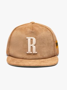 Premium suede hat with "R" embroidered on the front, and Rhude flag on the side. Features an adjustable strap at the back, so you can adjust the fit to your preference, and green under brim. Brim measures approx 2.5" in length 100%SUEDE / 65% POLY35% COTTON TWILLSpot clean with distilled soapy water.One size fits all. Casual Leather Hat With Flat Crown, Adjustable Leather Hat For Streetwear, Leather Snapback Hat For Streetwear, Leather Baseball Cap With Logo Patch And Flat Brim, Leather Cap For Streetwear, Adjustable Leather Snapback Hat With Flat Brim, Film Gift, Suede Hat, Cashmere Hat