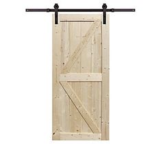 an open wooden door with black hardware on the top and bottom, against a white background