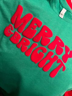 a green shirt with red letters on it that says happy mother's day written across the chest