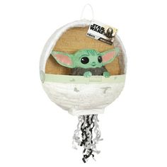 a star wars baby yoda toy hanging from a chain