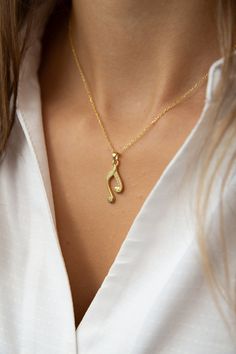 Celebrate the beauty of music with our handcrafted music note necklace. Embrace the harmony of life with our sterling silver musical note pendant, a symbol of musical connection.  Express your love for music with our tune-inspired necklace, a whimsical piece of music jewelry. Symbolize passion and rhythm with our melodic beauty necklace, capturing the essence of musicality. Minimalist design meets the charm of music in our delicate music charm necklace. Evoke the magic of music with our golden m Piano Necklace, Music Note Jewelry, Music Note Necklace, Beauty Necklace, Musical Jewelry, Lovers Necklace, Music Jewelry, Musician Gifts, Inspired Necklace