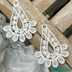 Beautiful embroidered white lace earrings by JOHANNIKA for that special bride! Our whimsical drop earrings come with a silver plated ear wire. They are lightweight and comfortable to wear and include a plastic backing for added security. They can be hand washed and not lose their shape! These romantic JOHANNIKA earrings come in a beautiful presentation and can include a special message. Matching necklace is also available - feel free to contact us. White Teardrop Bridal Earrings For Pierced Ears, Delicate Handmade White Chandelier Earrings, White Filigree Dangle Jewelry, White Teardrop Chandelier Earrings For Wedding, Delicate White Chandelier Drop Earrings, Delicate White Teardrop Chandelier Earrings, Delicate White Lace Jewelry, Handmade White Teardrop Bridal Earrings, White Bohemian Teardrop Earrings For Pierced Ears