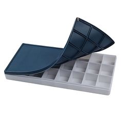 an empty ice tray with two compartments for different items to put in it, on a white background