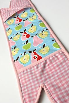 an oven mitt with apples and gingham checkered fabric on the bottom