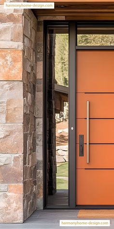 an orange front door with two sidelights