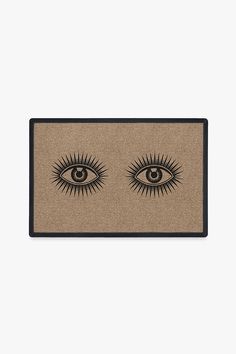 an eye rug with two eyelashes on the front and one lashes on the back, in black