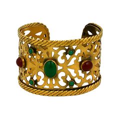 Elegant cuff by Yves Saint Laurent in the Byzantine taste of antique bronze pierce worked metal set with cabochon faux gems in carnelian and green onyx. Twisted metal banding trims the edges. 2" width, 7.25" length with 1" opening. France 1980s. Excellent condition. Golden Bangles, Ysl Jewelry, Twisted Metal, Antique Bracelets, Antique Gold Jewelry, Gold Bracelet Cuff, Designer Fashion Jewelry, Colorful Jewelry, Indian Style