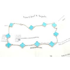 Van Cleef & Arpels 18k White Gold 10 Motif Alhambra Turquoise Necklace Paper  This is an extremely rare, highly collectible turquoise Alhambra necklace by Van Cleef & Arpels*** This necklace comes with service paper from a VCA store and a VCA box.   Metal: 18k white gold  Length: 17" Width:  15mm  Weight: 22 grams  Stones: 10 motifs of Turquoise Alhambra shape stones 15mm each  Hallmarks: VCA 750 BL72405(serial number omitted) T3184orddd  Please reference the dimensions in the description for the best approximate dimensions. Luxury Sterling Silver Turquoise Necklace, Luxury Sterling Silver Necklace In Turquoise, Luxury Turquoise Sterling Silver Necklace, Luxury Blue Hallmarked Necklace, Luxury Round Turquoise Necklace, Luxury Turquoise Gemstone Necklace, Luxury Turquoise Pendant Jewelry, Luxury Turquoise Round Necklace, Luxury Blue Turquoise Gemstone Necklace