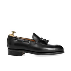 MENS TASSEL LOAFERS IN BLACK BOX CALF Luxury Black Plain Toe Tassel Loafers, Luxury Black Tassel Loafers With Plain Toe, Timeless Black Tassel Loafers With Brogue Detailing, Black Timeless Slip-on Tassel Loafers, Timeless Black Tassel Loafers For Business, Black Moc Toe Tassel Loafers With Goodyear Welt, Black Goodyear Welted Moc Toe Tassel Loafers, Timeless Black Tassel Loafers With Leather Sole, Timeless Black Tassel Loafers With Round Toe