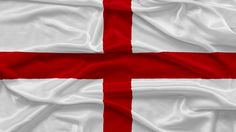 the flag of england is waving in the wind