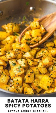 a pan filled with cooked potatoes and garnished with parsley on the side text reads, batata hara spicy potatoes little sunny kitchen