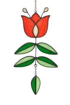 a stained glass flower hanging from a chain