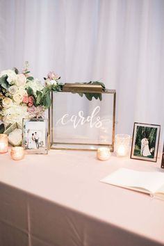 a table with candles and pictures on it