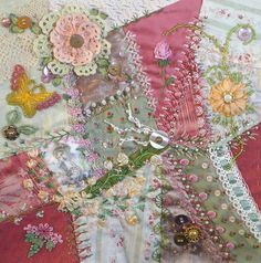 a close up view of some fabric with flowers and beads on it's side