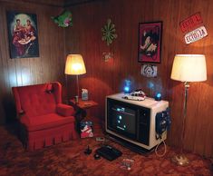 a living room with an old fashioned tv in the corner