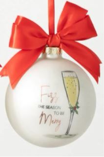 a glass ornament with a red bow on it's neck and the words fab, the season to be merry