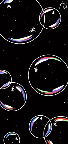 an image of colorful bubbles floating in the air with stars and circles around them on a black background