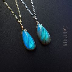 💙 Experience the subtle elegance of our Labradorite necklace, a must-have for those seeking to tap into their inner power, with its unique blue, green, or gold colour flashes, which add a touch of intrigue and beauty to any outfit. Let the Labradorite guide you on your journey towards transformation and strength. 🔮 ⭒ Chain Material: 925 Sterling Silver ⭒ Chain Length: 16-18" / 18-20" Inches ⭒ Finish: Silver * Gold * Rose Gold ⭒ Gemstone Size: 10x20mm  ⭒ Each necklace comes with a crystal infor Labradorite Gemstone Drop Necklaces, Labradorite Drop Gemstone Necklaces, Labradorite Drop Necklace With Gemstone, Handmade Labradorite Drop Necklaces, Handmade Drop-shaped Labradorite Necklaces, Handmade Labradorite Drop Necklace, Teardrop Labradorite Necklace, Wire Wrapped Labradorite Teardrop Pendant Necklace, Green Labradorite Teardrop Jewelry