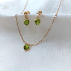 Peridot Jewelry Set, peridot necklace, peridot earrings, Heart Pendant Necklace, Dainty Gold Filled necklace, Minimalist Jewelry  𖤓 Materials: Sterling Silver 925 covered in 24kt gold, lab made gemstones.  𖤓 Heart Size : 5 mm 𖤓 Earring stud ball size: 4 mm 𖤓 Chain length: 16 inches plus 1 inch extender : ̗̀➛ Comes in velvet pouch : ̗̀➛ We Ship Worldwide : ̗̀➛ go back to Shop front: https://www.etsy.com/shop/StevaniJewels ⋆｡ ﾟ☁︎｡ ⋆｡ ﾟ☾ ﾟ｡ ⋆ More Info ⋆｡ ﾟ☁︎｡ ⋆｡ ﾟ☾ ﾟ｡ ⋆ **Stunning Peridot Eleg Dainty Green Peridot Jewelry, Dainty Green Heart Jewelry, Green Dainty Jewelry For Valentine's Day, Dainty Gemstone Jewelry, Gold Jewelry Set, Necklace Minimalist Jewelry, Peridot Jewelry, Peridot Pendant, Peridot Earrings