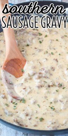 southern sausage gravy in a black skillet with a wooden spoon on the side