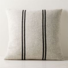 a white pillow with black stripes on it