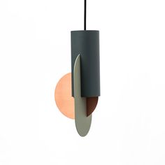 a modern light fixture hanging from the ceiling