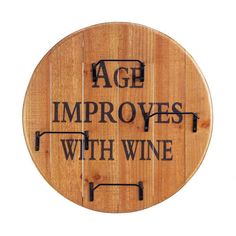 a wooden sign that says age employees with wine