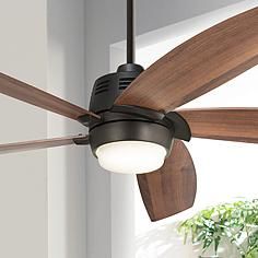 a ceiling fan with two wooden blades and a light on the top one is turned on