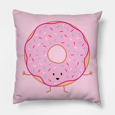 a pink pillow with a cartoon donut on it