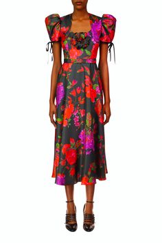 Tailored in Rodarte’s dramatic black and red silk twill floral print, this modern midi has a fitted bodice that eases into a full circle skirt. A single hand molded printed silk flower accents its sweetheart neckline and a belt adorns the waist. Short puff sleeves edged by black piping and tied in bows add the perfect Silk Floral Print Midi Dress For Evening, Silk Floral Print Midi Cocktail Dress, Red Floral Print Midi Dress For Evening, Evening Midi Dress With Floral Print In Tea Length, Multicolor Floral Print Midi Dress For Evening, Evening A-line Midi Dress With Floral Print, Red Silk Midi Dress With Floral Print, Floral Print A-line Midi Dress For Evening, Black Satin Dress With Floral Print