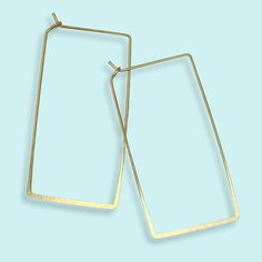 Gold light-weight boxy rectangle hoop earrings. Metal: 14kt gold-plate over brass Size: 2.25" L Made in the USA Nickel Free Affordable Metal Rectangular Earrings, Affordable Trendy Rectangular Hoop Earrings, Cheap Rectangular Hoop Earrings As Gift, Cheap Trendy Rectangular Hoop Earrings, Rectangle Hoop Earrings, Earrings Metal, Gold Light, 14kt Gold, Arrow Necklace