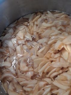 the food is being cooked in the pot on the stove