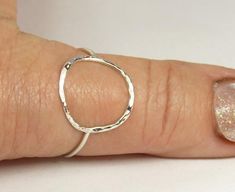 A hammered circle ring made with 18 gauge wire. Modern and simple minimal jewelry.Made with sterling silver Handmade and polished to a high shine in my shop.The circle symbol meaning is universal, sacred and divine. It represents the infinite nature of energy, and the inclusivity of the universe.Purity ring, karma ring,  midi ring modern and simpleIt's normal for sterling silver to change color to yellow or black due to oxidation after wear, just polish with warm water and a soft cloth, or use S Minimalist Hammered Sterling Silver Midi Rings, Hammered Sterling Silver Midi Rings, Silver Hammered Minimalist Midi Rings, Simple Hammered Rings, Hand Forged Sterling Silver Stackable Rings, Silver Hammered Midi Rings, Karma Ring, Silver Jewelry Cleaner, Circle Symbol