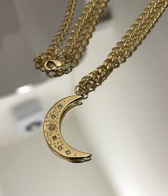 PRODUCT DESCRIPTION 14k Gold Filled Moon Star Crescent Necklace Pendant - 16 x 14mm Chain - 16" + 2" extender CARE ADVICE - Avoid exposure to perfumes, lotions and other chemicals - Remove before bathing, swimming and exercising - Do not wear while sleeping - Store in a dry and cool place DISPATCH & DELIVERY TIMES All items are made to order. It usually takes one working day to prepare and ship an order. SHIPPING INFORMATION UK - All jewellery is sent by Royal Mail Signed for 1st Class. (Usually Gold Star Jewelry With Moon Phase Detail, Gold Star-shaped Jewelry With Moon Phase Detail, Celestial Moon Shaped Necklace With Moon Print, Gold Crescent Celestial Jewelry, Gold Moon Phase Star Jewelry, Gold Moon Charm Necklace In Celestial Style, Gold Charm Necklace With Moon Phase, Gold Moon Charm Necklace, Celestial Style, Gold Half Moon Charm Necklace With Moon Phase