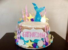 a birthday cake decorated with an ocean theme