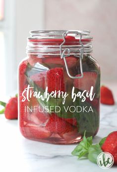 strawberry basil infused vodka in a mason jar