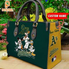 Oakland Athletics Disney Women Leather Hand Bag  Introducing our Women’s Handbag, the epitome of sophistication and versatility. Crafted with premium materials and exquisite attention to detail, it offers both style and functionality. With spacious compartments and elegant design, our handbag seamlessly transitions from day to night, adding a chic touch to any outfit. Elevate your accessory game with our Women’s Handbag, where fashion meets practicality in every stitch.Photos Of Oakland Athletics Disney Women Leather Hand Bag [thien_display_attachment_images]Product details: Oakland Athletics Disney Women Leather Hand Bag [block id="detail-leather-bag"] Disney Bags For Daily Use, Daily Disney Style Bag, Disney Rectangular Bags For Disney Fan Events, Disney Satchel Bag For Everyday Use, Disney Rectangular Shoulder Bag For Everyday Use, Disney Tote Bag For Everyday Use, Disney Rectangular Shoulder Bag For Daily Use, Disney Style Gift Bag, Rectangular Shape, Disney Names