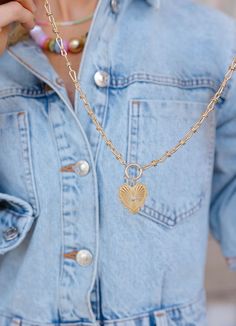 This vintage inspired gold toggle necklace with a heart charm is more than just a pretty piece—it's a daily reminder to love yourself and share that love with the world. The charm hangs on a beautifully unique chain, adding a trendy twist to your everyday look. Whether you’re dressing up or keeping it casual, this necklace is a stylish way to spread love and kindness wherever you go! Features • Gold plated brass • Measures 15.5” plus a 3” extender, 1.5” dropdown heart Feminine Gold Necklace With Heart Charm, Feminine Gold Heart Pendant Necklaces, Trendy Everyday Heart Pendant Charm Necklace, Everyday Trendy Heart Bead Necklaces, Trendy Everyday Necklace With Heart Beads, Trendy Everyday Heart Beads Necklace, Trendy Everyday Necklaces With Heart Beads, Trendy Everyday Chain Necklace With Heart Charm, Trendy Chain Necklace With Heart Charm For Everyday