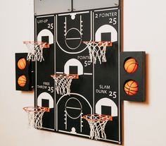 a wall mounted basketball game on a white wall