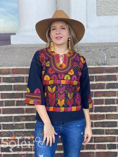 This beautiful Mexican Embroidered Blouse is perfect for any formal event or daily use! These blouses are hand embroidered by Mexican Artisans and completely one of a kind. Note: Model is wearing a M/L Traditional Tops With Intricate Embroidery For Fall, Folk Style Embroidered Top With Woven Motifs, Traditional Blouse With Woven Motifs For Festive Occasion, Embroidered Multicolor Long Sleeve Blouse Piece, Multicolor Embroidered Top For Fall Festival, Multicolor Embroidered Long Sleeve Blouse Piece, Long Sleeve Embroidered Multicolor Blouse Piece, Multicolor Long Sleeve Top With Embroidered Neckline, Traditional Festive Top With Embroidered Neckline