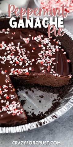 a chocolate peppermint ganache pie with a slice missing