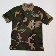 Brand New With Tags Attached Big Kids Size 18-20. * Measurements Are Attached In The Pictures This Should Easily Fit A Small Man Or Small/Medium Woman. See Attached Measurements To Ensure Proper Sizing. Please See All Attached Pictures For Any Additional Details. Green Military Style Short Sleeve Top, Green Cotton Polo Shirt With Graphic Print, Military Style Camouflage Cotton Shirt, Casual Camouflage Cotton Shirt, Casual Cotton Camouflage Shirt, Camouflage Military Short Sleeve Tops, Military Camouflage Short Sleeve Tops, Camouflage Military Top With Short Sleeves, Military Style Camouflage Short Sleeve Tops