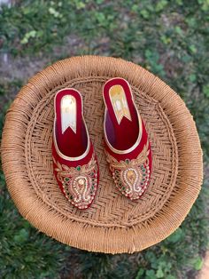 These shoes, paying homage to a heritage of Nepali style and renowned craftsmanship, are handmade and hand embroidered by local Nepalese women artisans and support their artisanal craft.  Due to the nature of handmade natural dye process, the coloring on the insole may fade after few wears. Traditional Handmade Closed Toe Heels, Traditional Heels With Gota Work And Closed Toe, Traditional Embroidered Festive Heels, Traditional Embroidered Closed Toe Heels, Traditional Closed Toe Embroidered Heels, Traditional Handwork Heels For Festivals, Traditional Festive Heels With Dori Work, Traditional Festive Closed Toe Heels, Traditional Embroidered Open Toe Heels