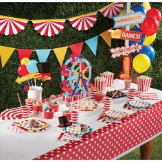 a carnival themed birthday party with red, white and blue desserts on a table