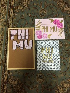 three different greeting cards sitting next to each other on top of a carpeted floor