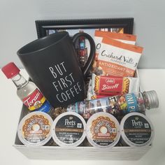 the coffee gift basket is filled with coffee, tea and snacks for someone to enjoy